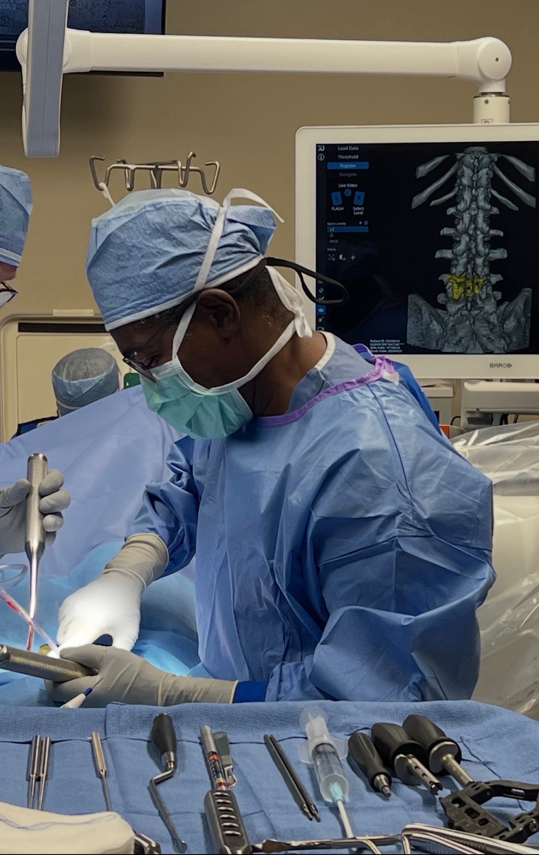 Dr. Tyndall performing minimally invasive spine surgery with computerized navigation